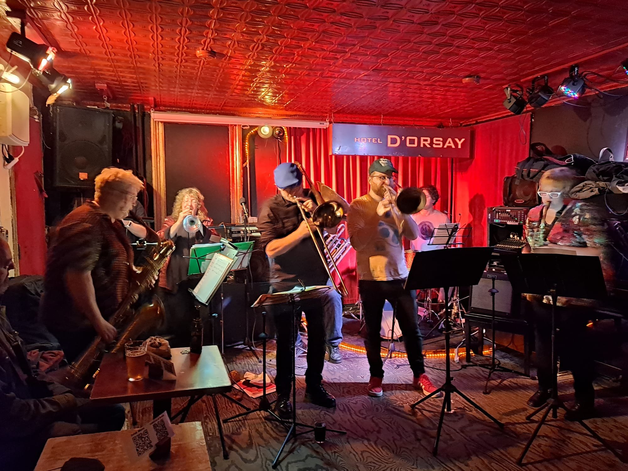 Swunky Z brass band perfoming in front of a red curtain